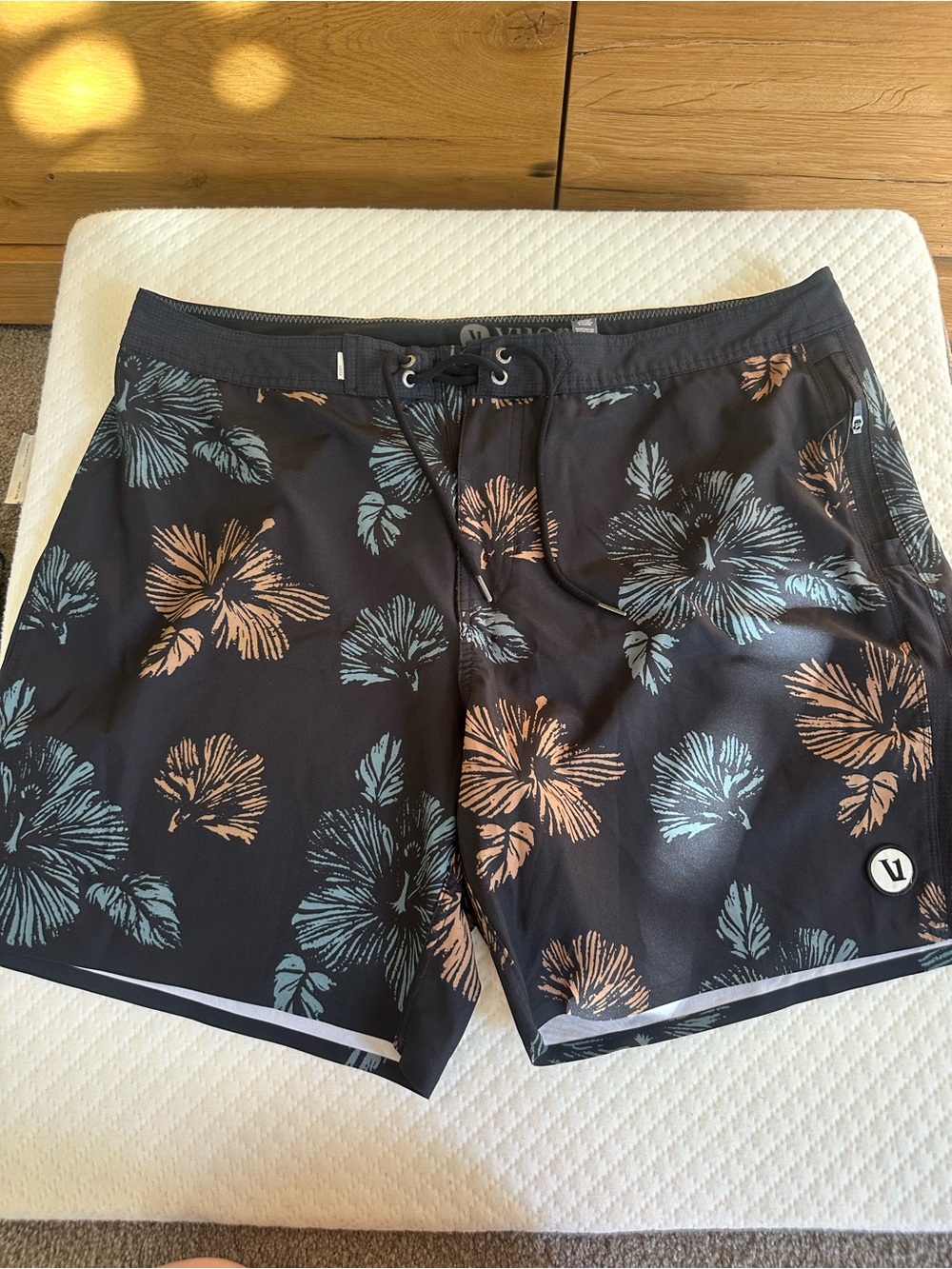 Vuori Black Swim Board Shorts with Blue & Peach Floral Design
